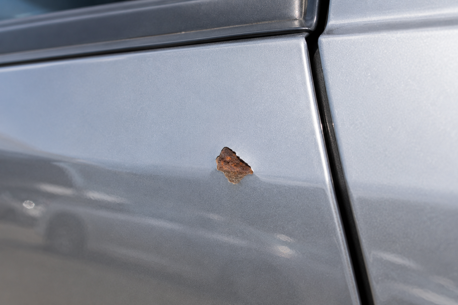 Rust on metallic car panel